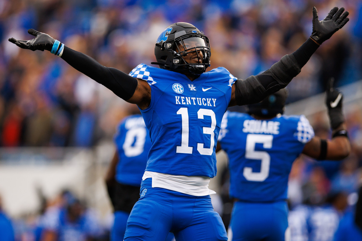 Nov 26, 2022; Lexington, Kentucky, USA; Kentucky Wildcats linebacker J.J. Weaver (13) celebrates during the first quarter against the Louisville Cardinals at Kroger Field. Mandatory Credit: Jordan Prather-USA TODAY Sports